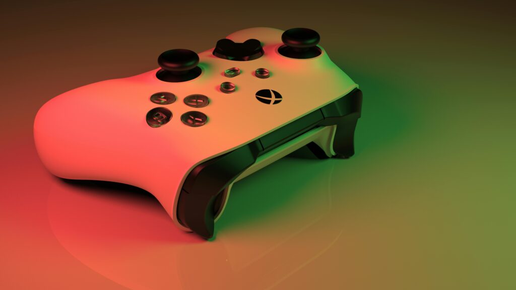 Xbox controller with glowing neon lights creating an ambient gaming atmosphere.